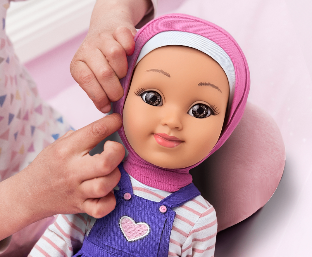 A child playing with a Salam Sisters hijabi doll
